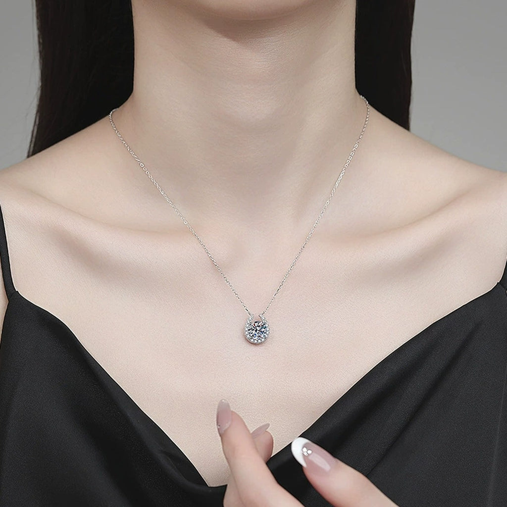Pear Halo Moissanite Pendant Necklace with Cubic Zirconia in Platinum-Plated S925 Sterling Silver worn on neckline by model