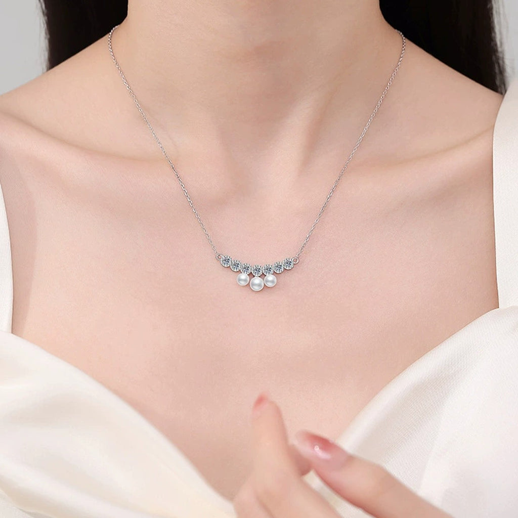 Graduated Freshwater Pearl Station Necklace in White Gold-Plated S925 Sterling Silver worn on neckline by model
