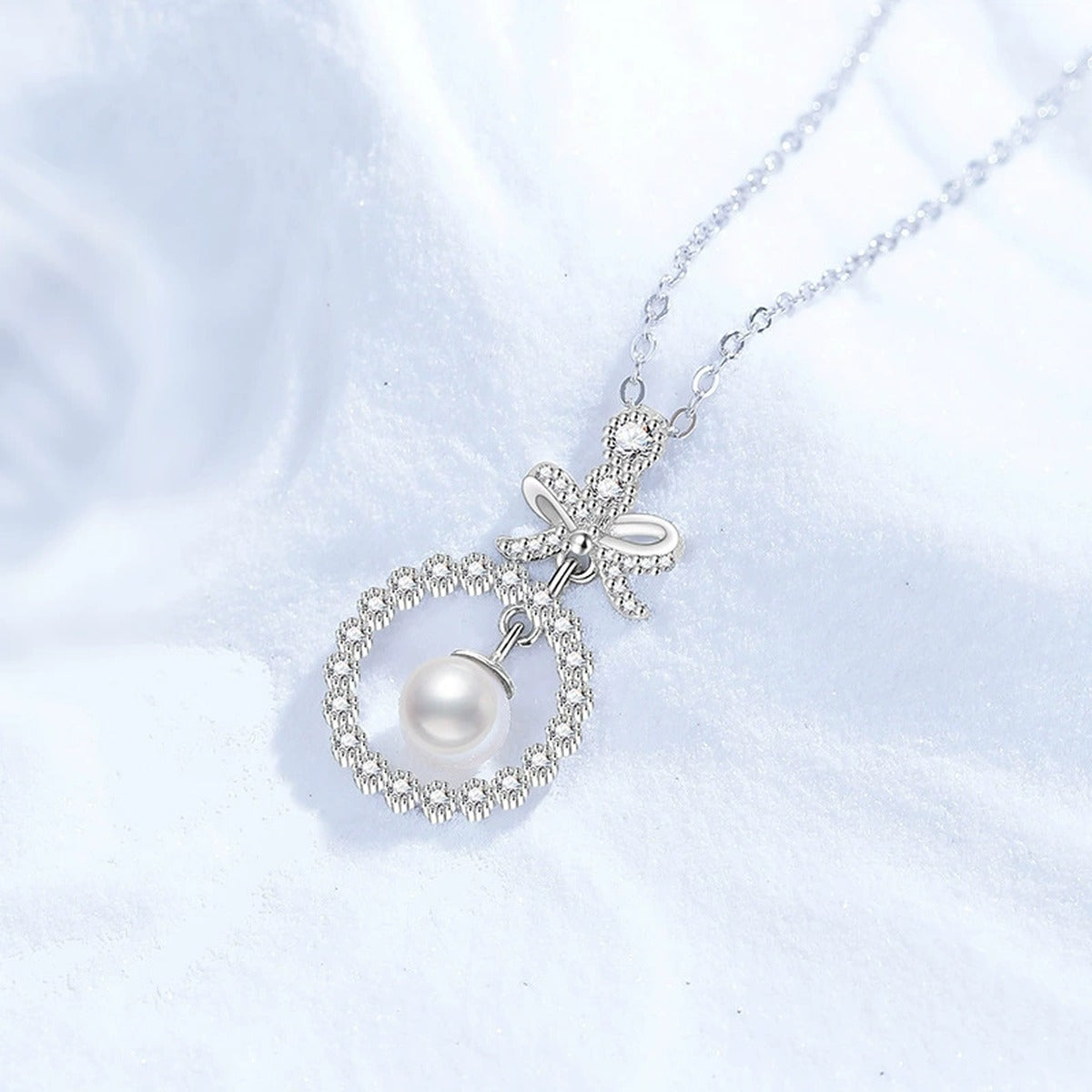 Bow Moissanite Freshwater Pearl Pendant Necklace with Cubic Zirconia in White Gold-Plated S925 Sterling Silver close-up product detail view