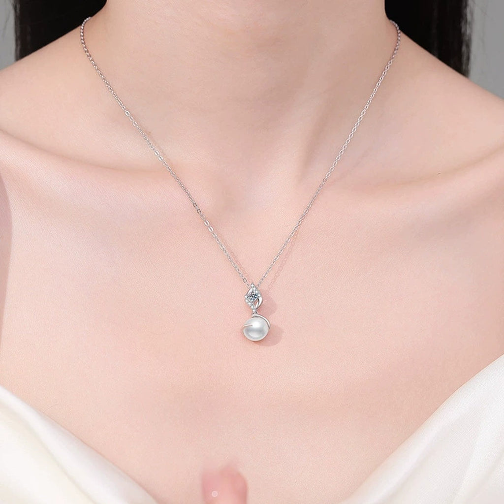 Swirl Moissanite Freshwater Pearl Pendant Necklace with Cubic Zirconia in White Gold-Plated S925 Sterling Silver worn on neckline by model