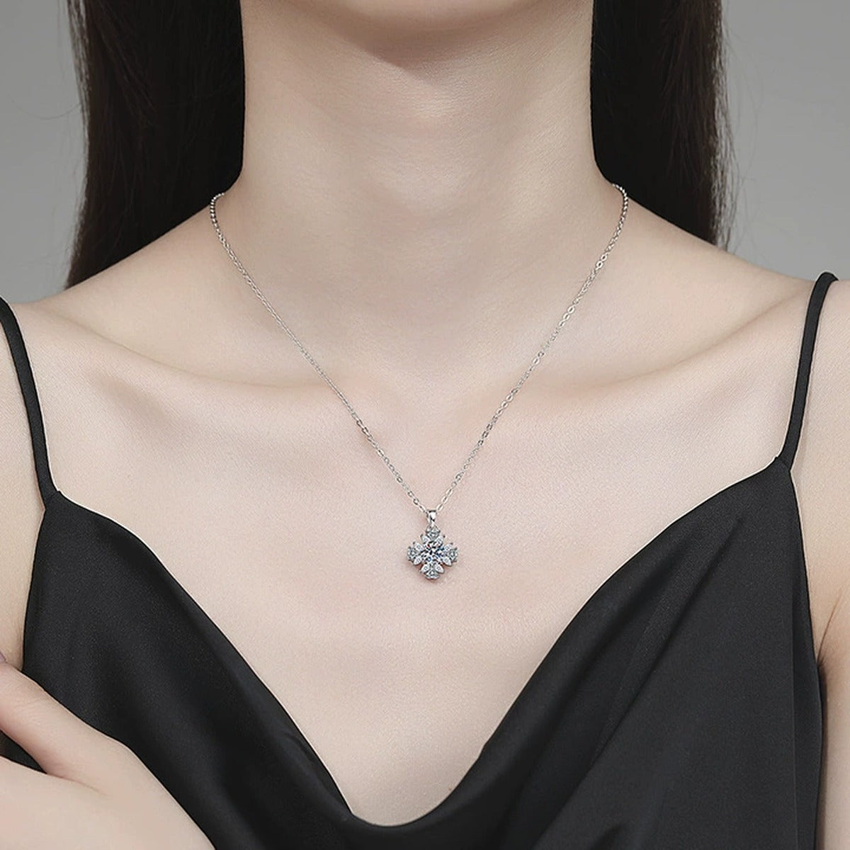Snowflake Moissanite Pendant Necklace with Cubic Zirconia in Platinum-Plated S925 Sterling Silver worn on neckline by model