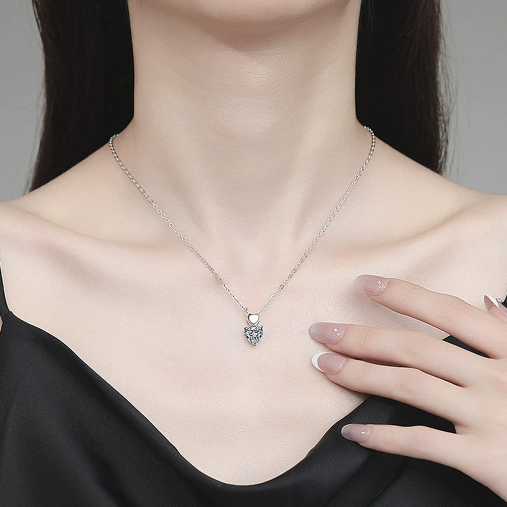 Pear Moissanite Pendant Necklace in Platinum-Plated S925 Sterling Silver worn on neckline by model