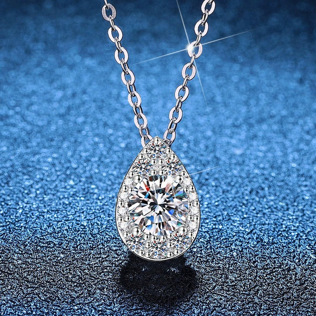 Pear Halo Moissanite Pendant Necklace with Cubic Zirconia in Platinum-Plated S925 Sterling Silver blue background product view