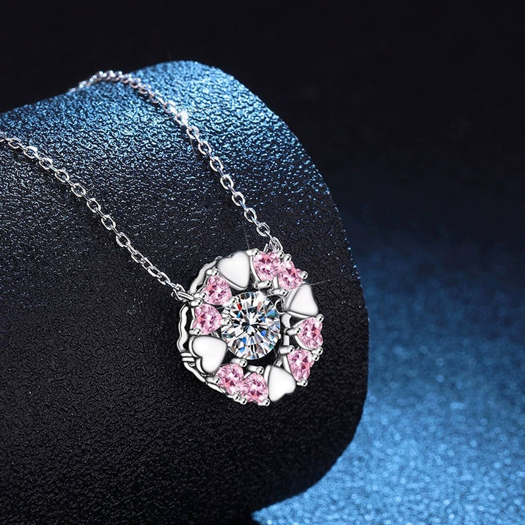 Floral Moissanite Pendant Necklace with Pink Cubic Zirconia in Platinum-Plated S925 Sterling Silver blue background angled view