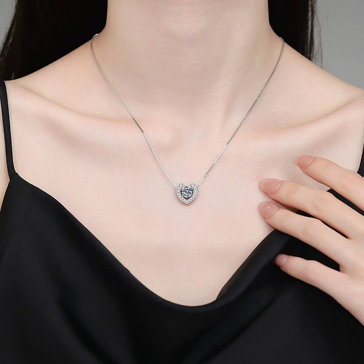 Heart Moissanite Pendant Necklace with Box Chain in Platinum-Plated S925 Sterling Silver worn on neckline by model