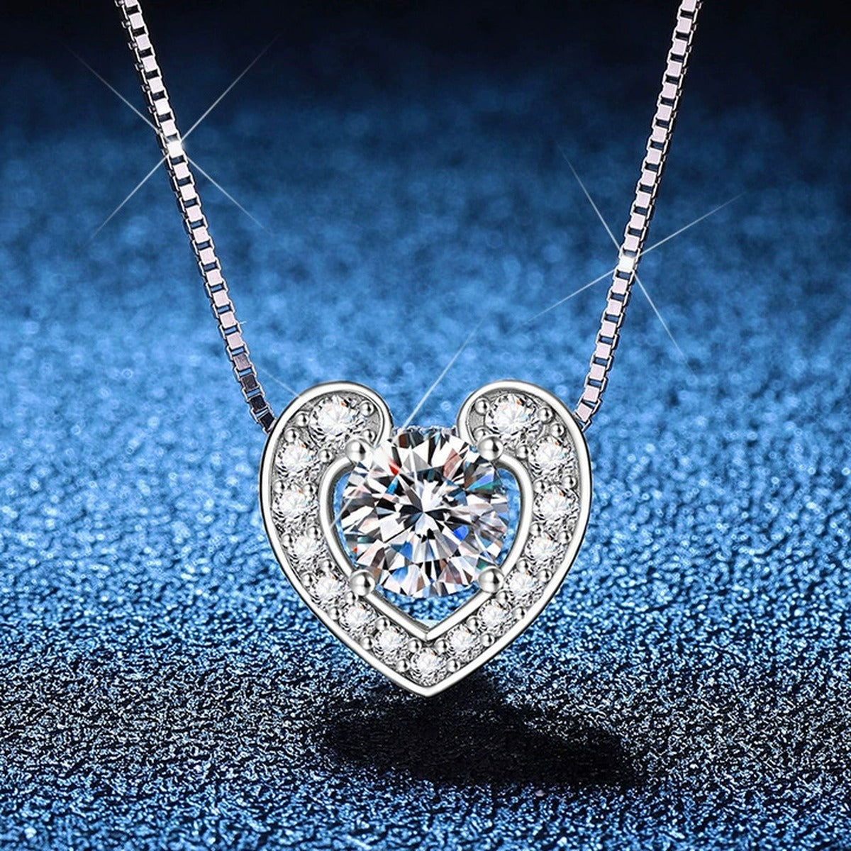 Heart Moissanite Pendant Necklace with Box Chain in Platinum-Plated S925 Sterling Silver blue background product view