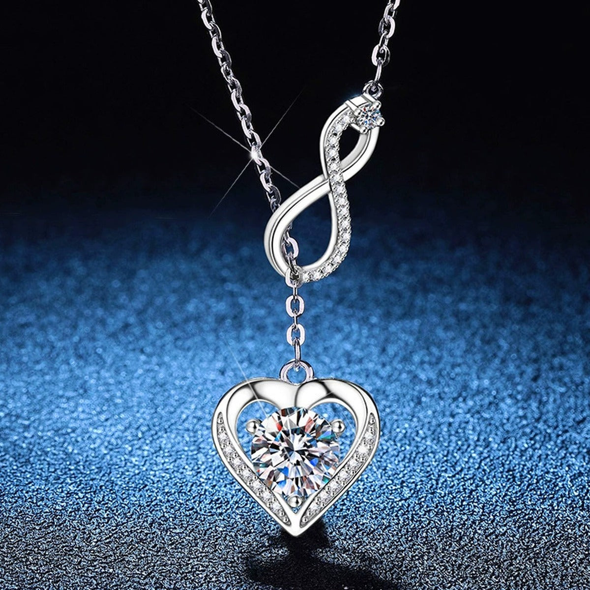 Infinity Heart Moissanite Pendant Necklace with Cubic Zirconia in Platinum-Plated S925 Sterling Silver blue background product view