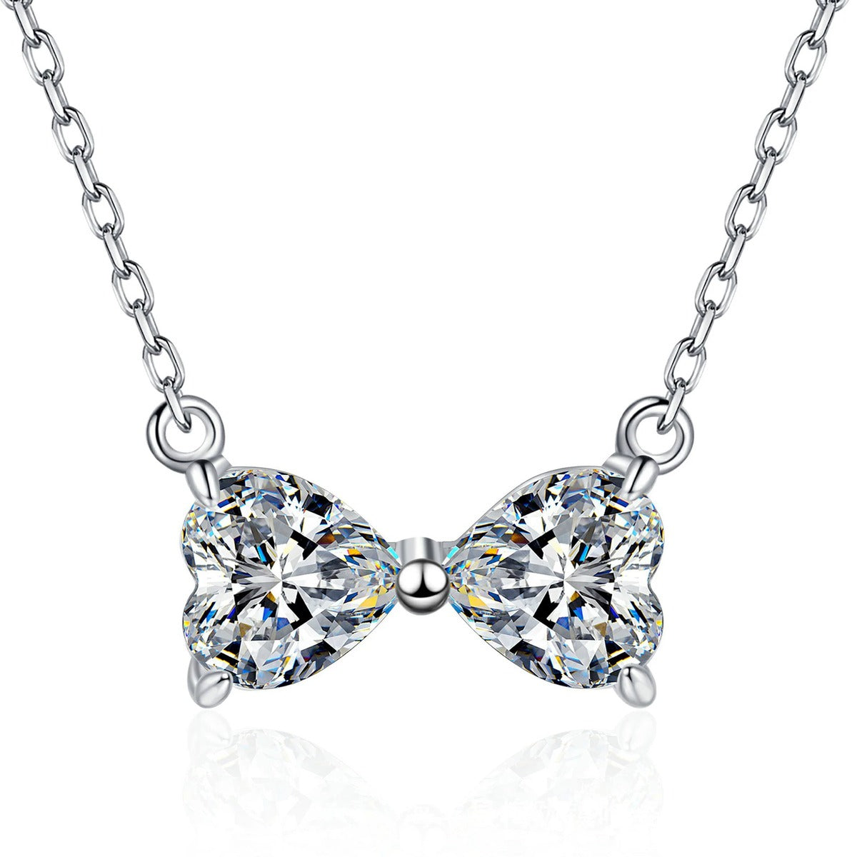 Bow Moissanite Necklace in Platinum-Plated S925 Sterling Silver on clean white background showing the bow-shaped necklace formed by two moissanite stones