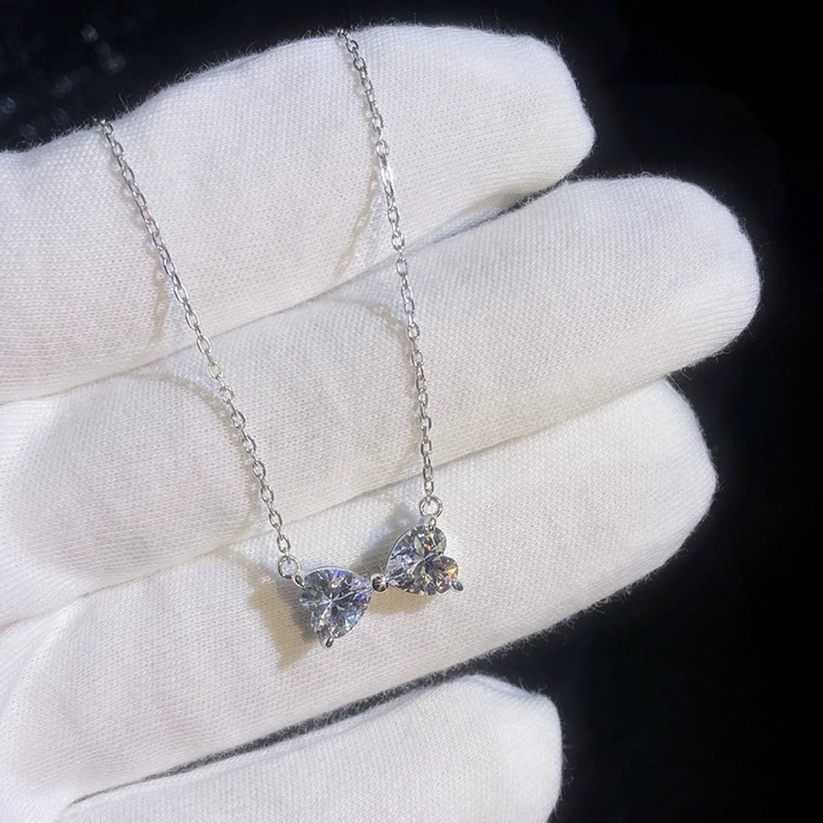 Bow Moissanite Necklace in Platinum-Plated S925 Sterling Silver dark background product display view