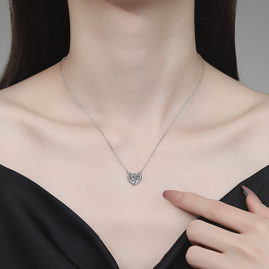 Heart Moissanite Pendant Necklace in Platinum-Plated S925 Sterling Silver worn on neckline by model