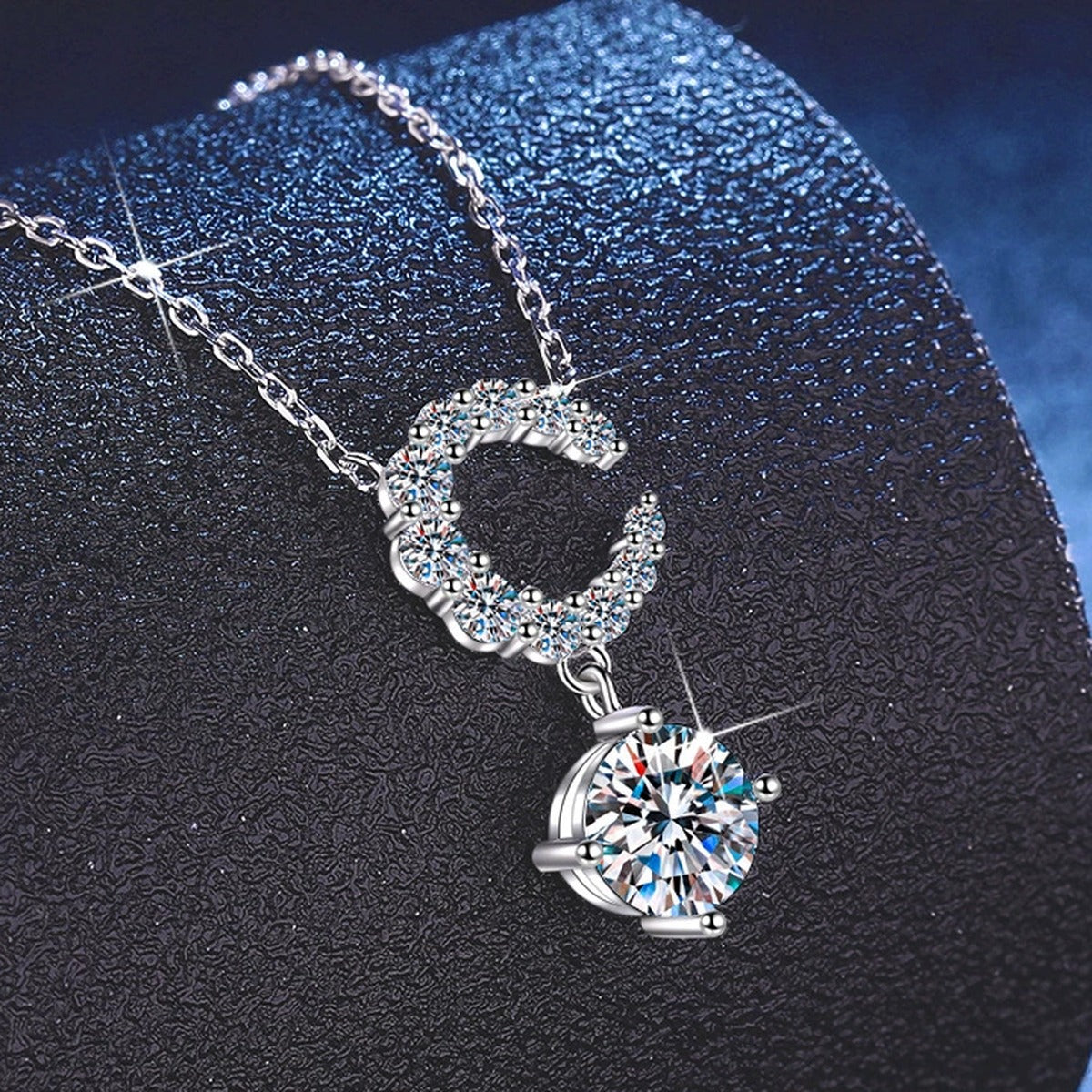 Crescent Moon Moissanite Pendant Necklace with Cubic Zirconia in Platinum-Plated S925 Sterling Silver close-up product detail view