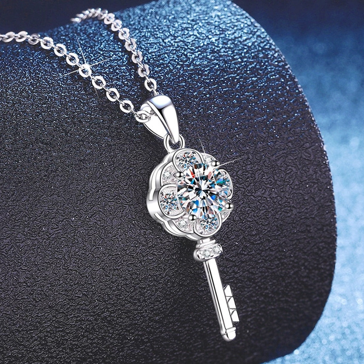 Key Moissanite Pendant Necklace with Cubic Zirconia in Platinum-Plated S925 Sterling Silver blue background angled view