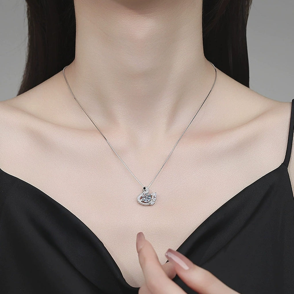 Swan Moissanite Pendant Necklace with Cubic Zirconia in Platinum-Plated S925 Sterling Silver worn on neckline by model