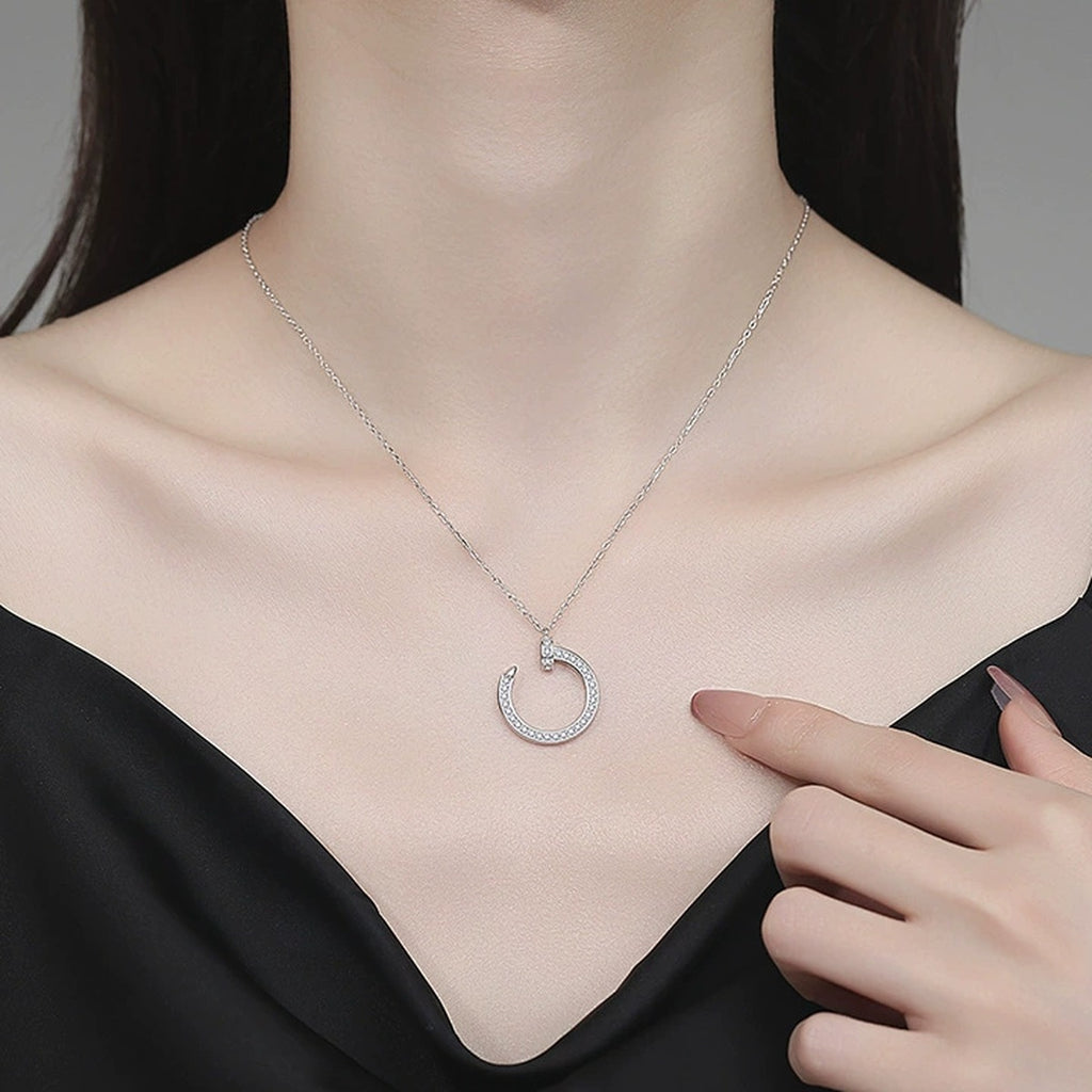 Crescent Moon Moissanite Pendant Necklace in Platinum-Plated S925 Sterling Silver worn on neckline by model