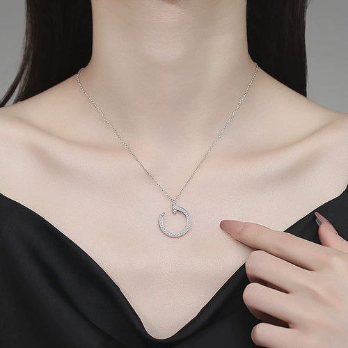 Crescent Moon Moissanite Pendant Necklace in Platinum-Plated S925 Sterling Silver worn on neckline by model