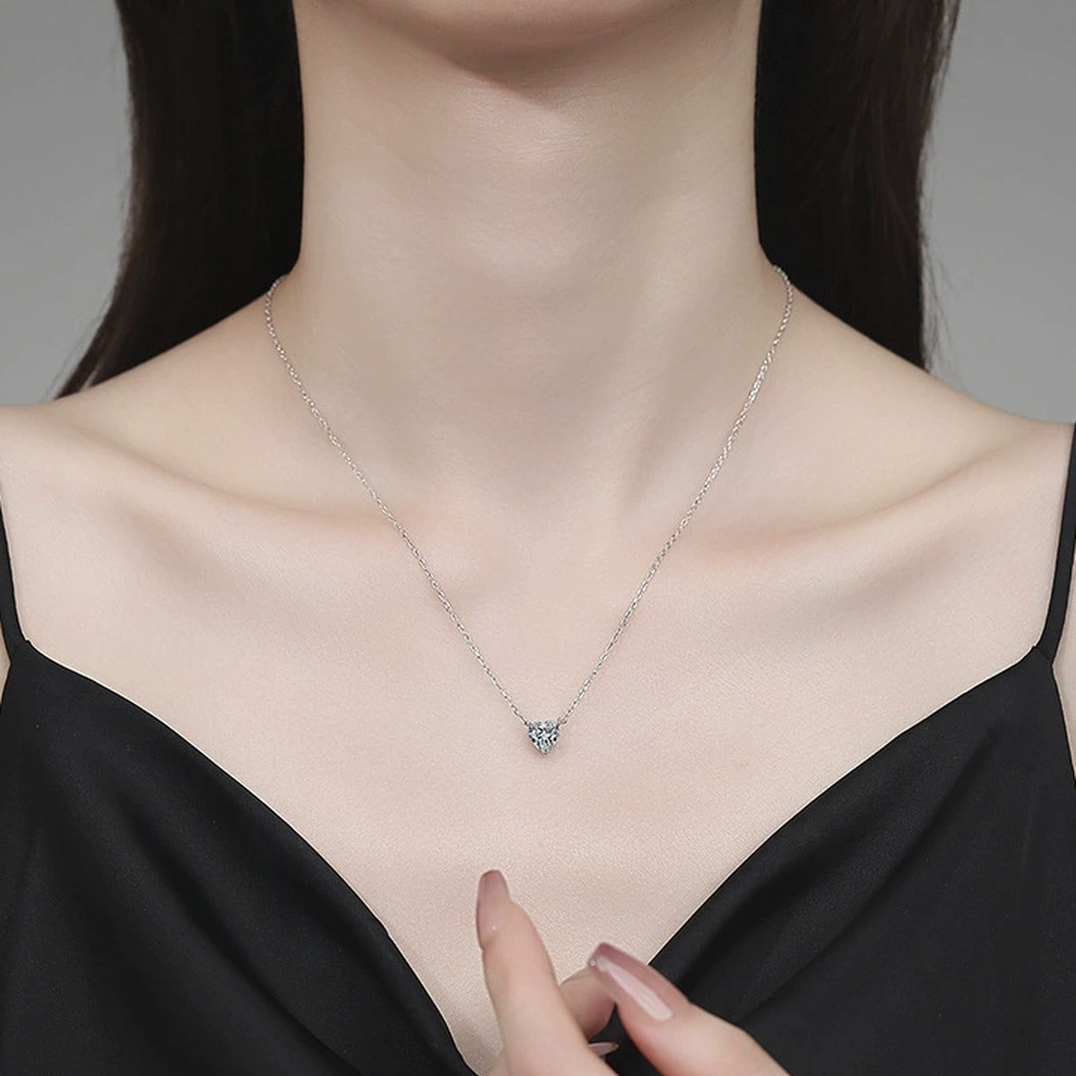 Heart Moissanite Pendant Necklace in Platinum-Plated S925 Sterling Silver worn on neckline by model