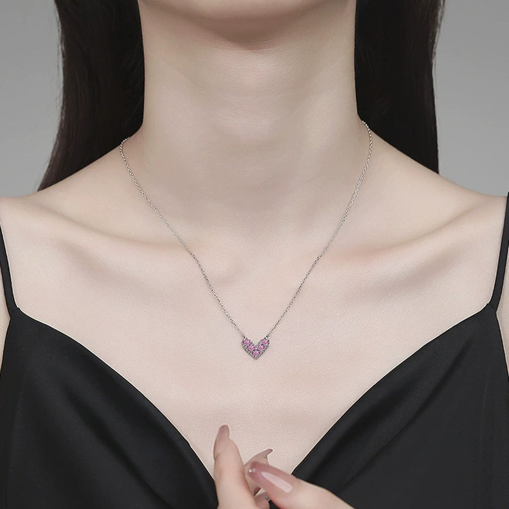 Heart Moissanite Pendant Necklace in Platinum-Plated S925 Sterling Silver worn on neckline by model