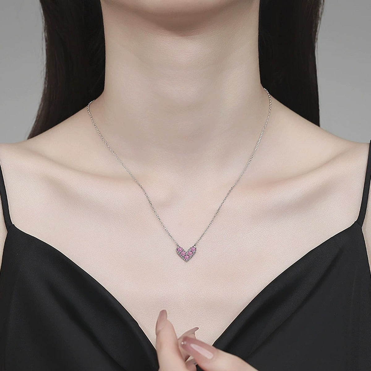 Heart Moissanite Pendant Necklace in Platinum-Plated S925 Sterling Silver worn on neckline by model