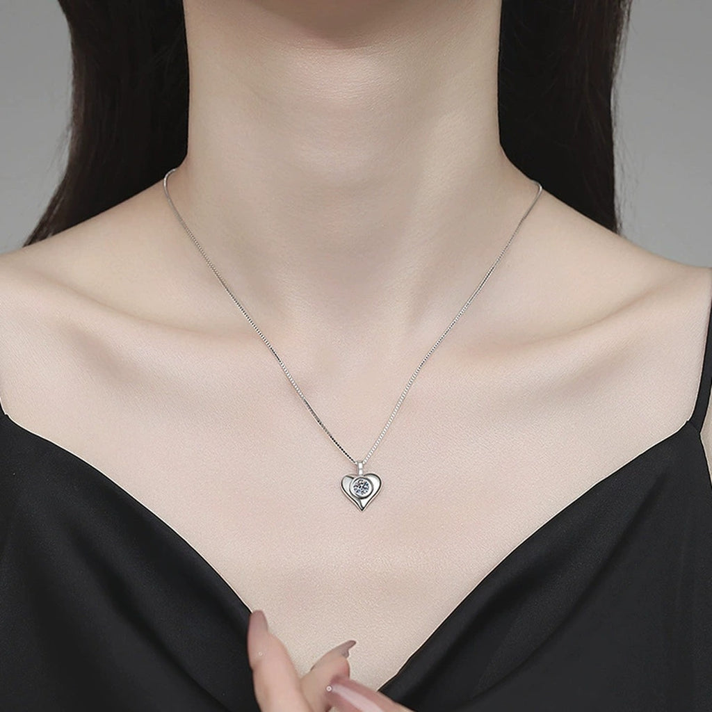 Smooth Heart Moissanite Pendant Necklace in Platinum-Plated S925 Sterling Silver worn on neckline by model