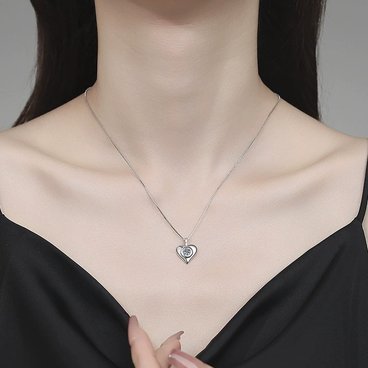Smooth Heart Moissanite Pendant Necklace in Platinum-Plated S925 Sterling Silver worn on neckline by model