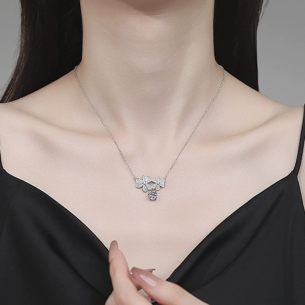 Floral Drop Moissanite Pendant Necklace with Cubic Zirconia in Platinum-Plated S925 Sterling Silver worn on neckline by model