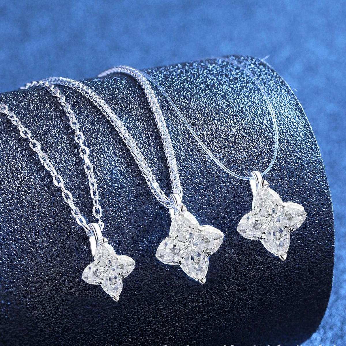 Geometric Moissanite Pendant Necklace in Platinum-Plated S925 Sterling Silver blue background angled view
