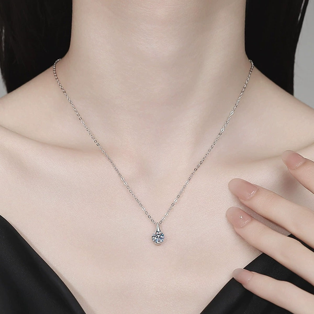 Teardrop Moissanite Pendant Necklace in Platinum-Plated S925 Sterling Silver worn on neckline by model
