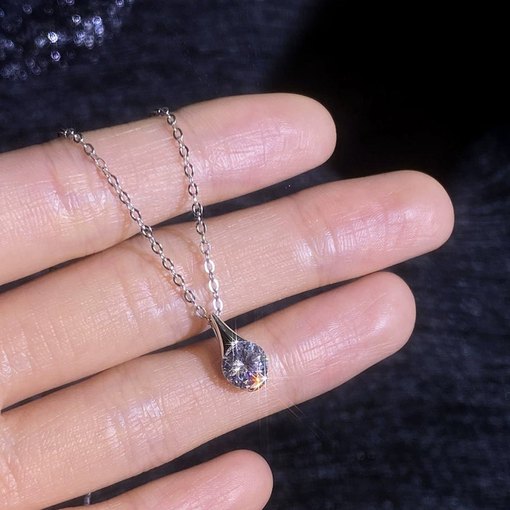 Teardrop Moissanite Pendant Necklace in Platinum-Plated S925 Sterling Silver worn on neckline by model