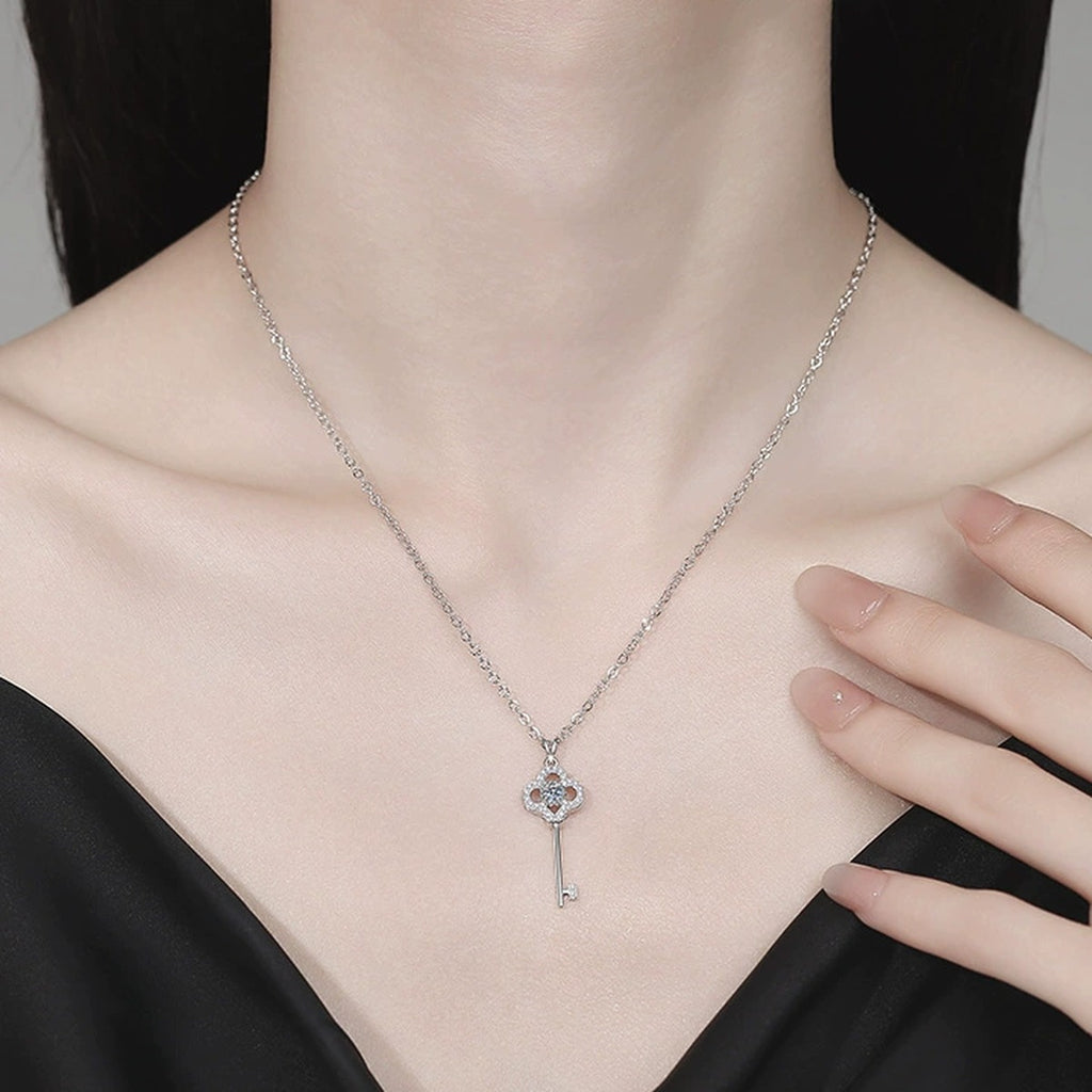 Key Moissanite Pendant Necklace with Cubic Zirconia in Platinum-Plated S925 Sterling Silver worn on neckline by model