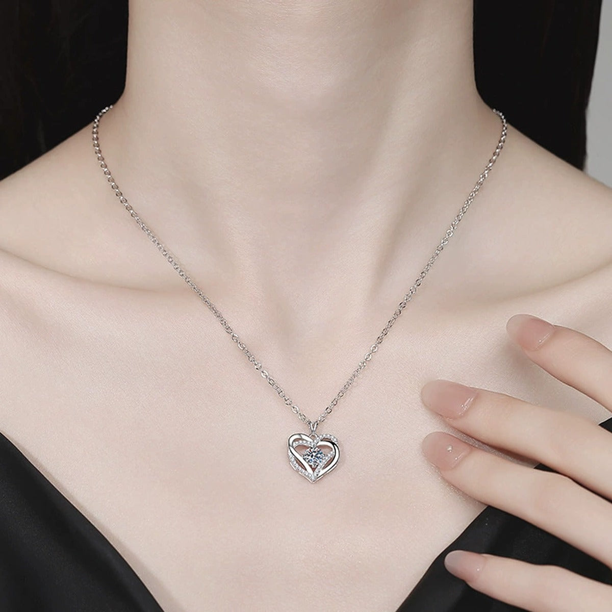 Heart Halo Moissanite Pendant Necklace with Cubic Zirconia in Platinum-Plated S925 Sterling Silver worn on neckline by model