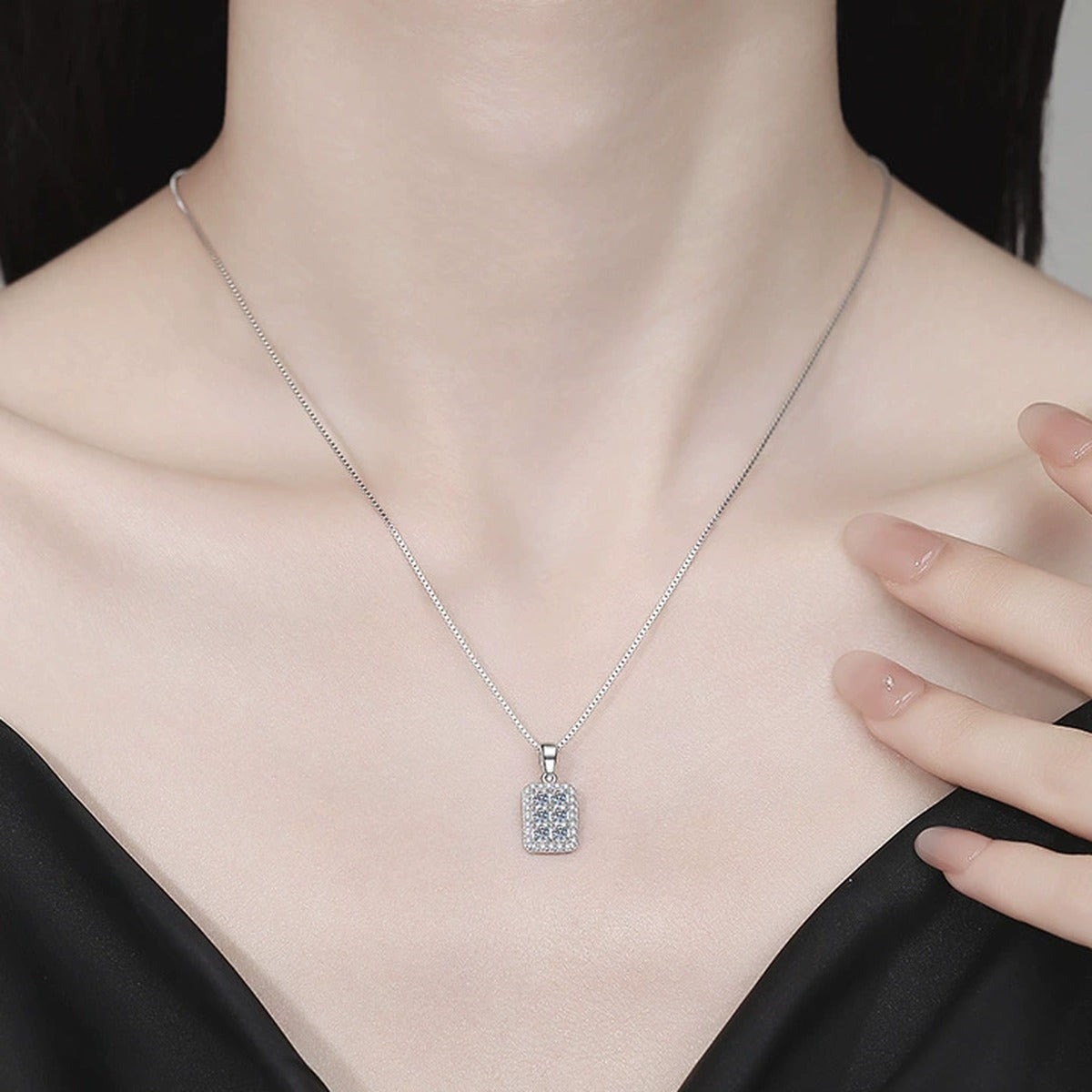 Rectangular Pavé Moissanite Pendant Necklace with Cubic Zirconia in Platinum-Plated S925 Sterling Silver worn on neckline by model