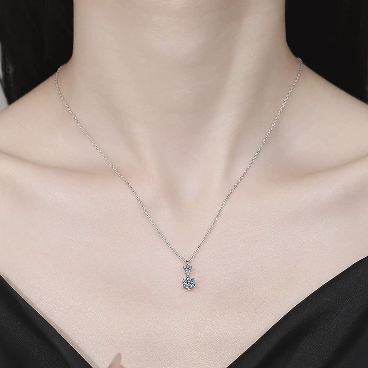Drop Moissanite Pendant Necklace in Platinum-Plated S925 Sterling Silver worn on neckline by model