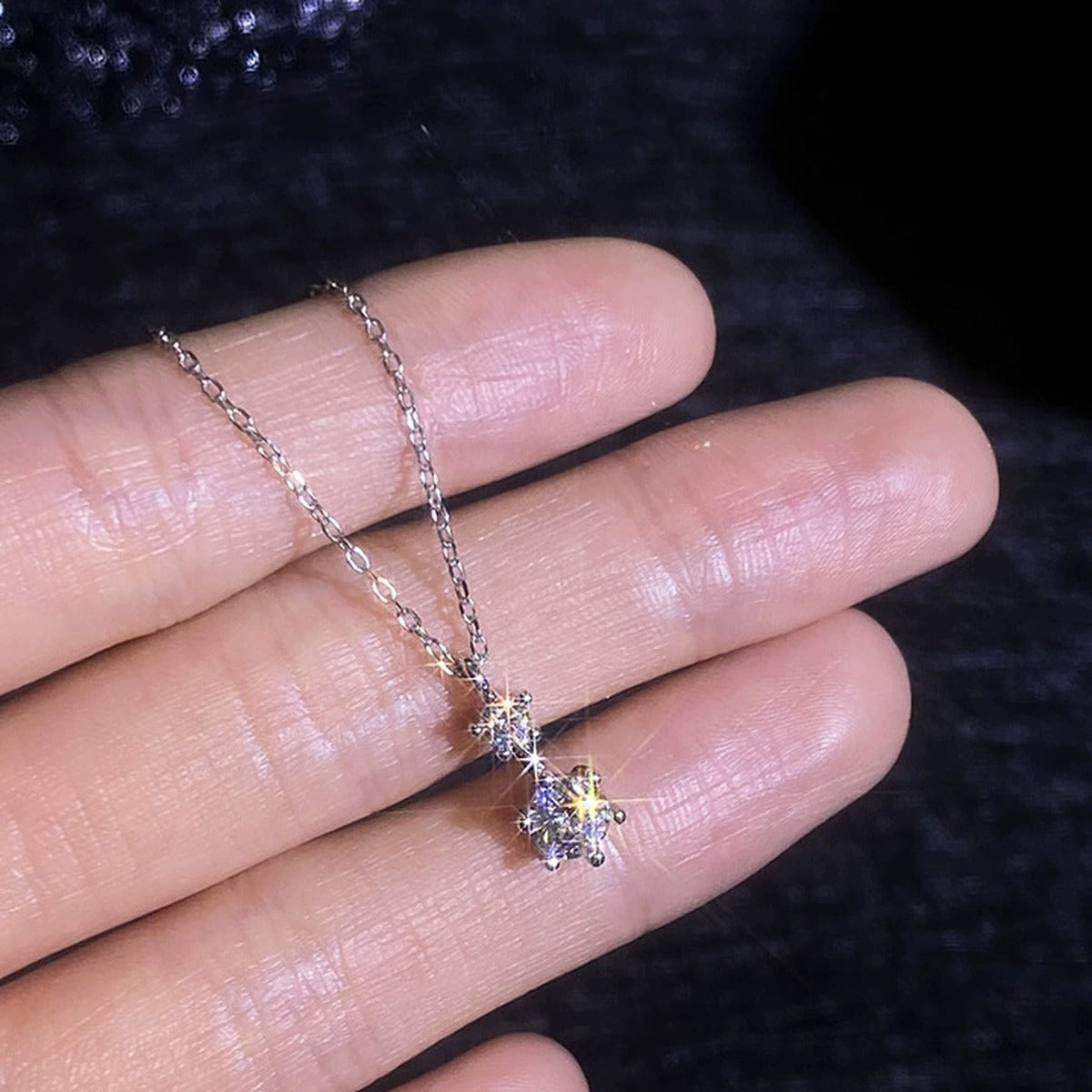 Drop Moissanite Pendant Necklace in Platinum-Plated S925 Sterling Silver worn on neckline by model