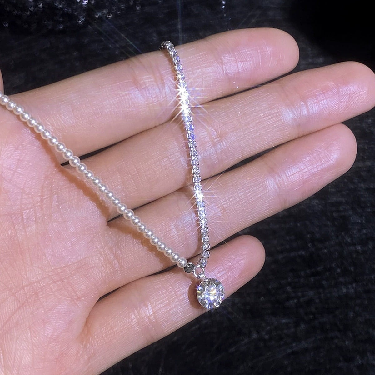 Pearl Strand Moissanite Pendant Necklace with Cubic Zirconia in Platinum-Plated S925 Sterling Silver worn on neckline by model