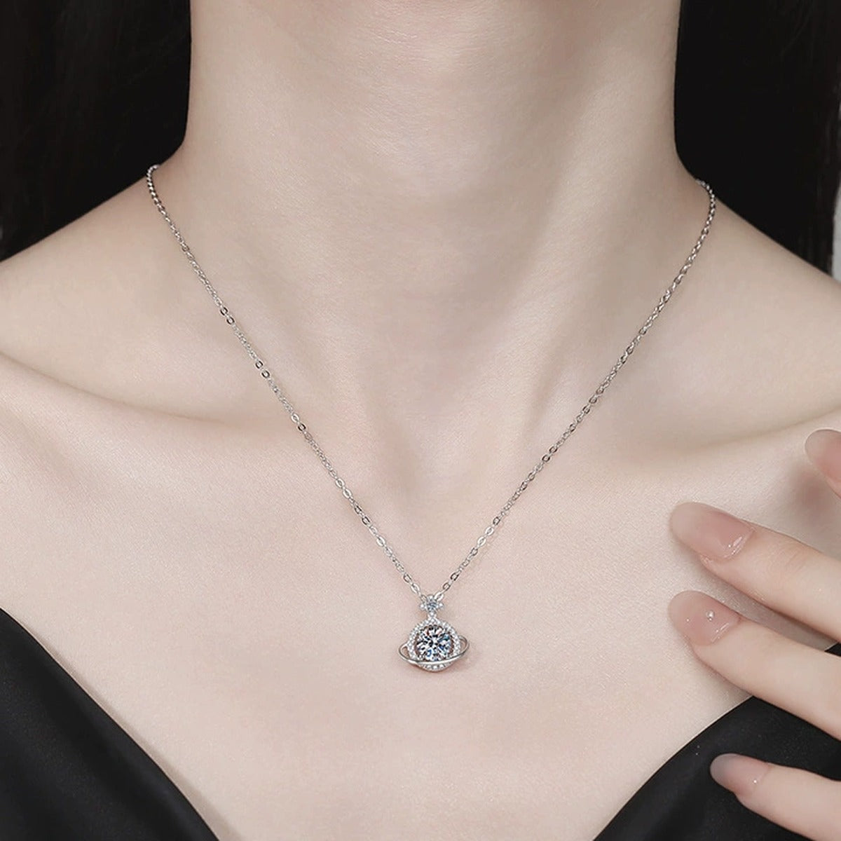 Saturn Halo Moissanite Pendant Necklace with Cubic Zirconia in Platinum-Plated S925 Sterling Silver worn on neckline by model