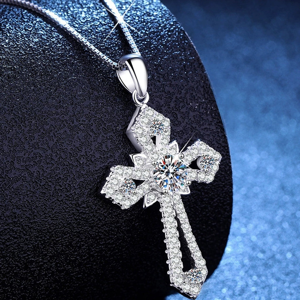 Cross Moissanite Pendant Necklace with Cubic Zirconia in Platinum-Plated S925 Sterling Silver blue background angled view