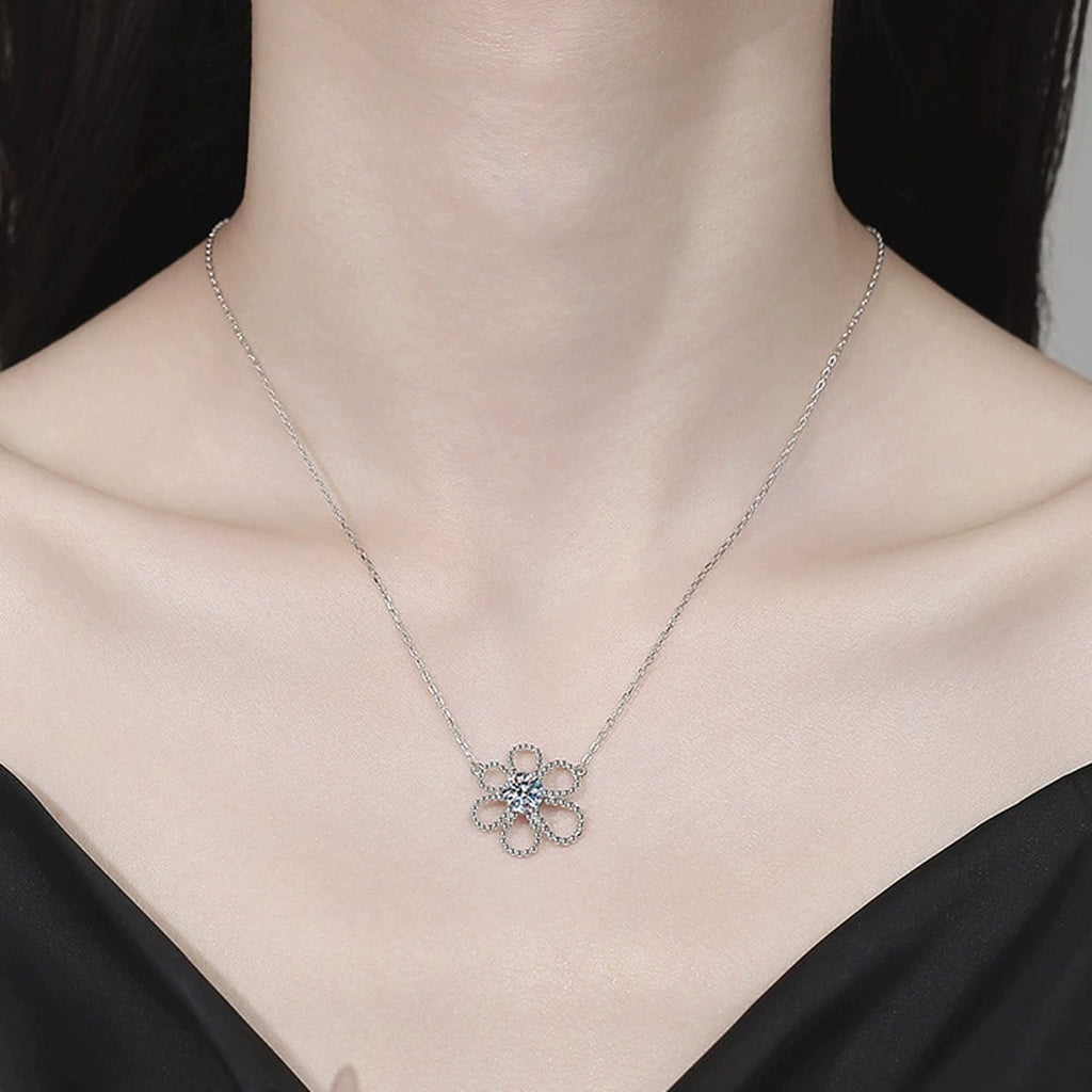Open Flower Moissanite Pendant Necklace in Platinum-Plated S925 Sterling Silver worn on neckline by model