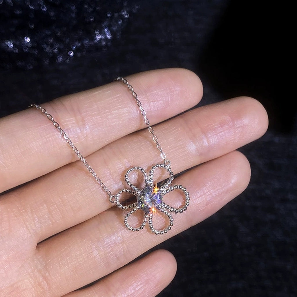 Open Flower Moissanite Pendant Necklace in Platinum-Plated S925 Sterling Silver worn on neckline by model