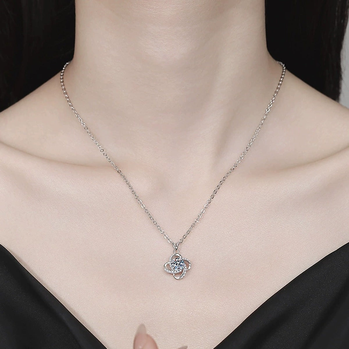 Floral Halo Moissanite Pendant Necklace with Cubic Zirconia in Platinum-Plated S925 Sterling Silver worn on neckline by model