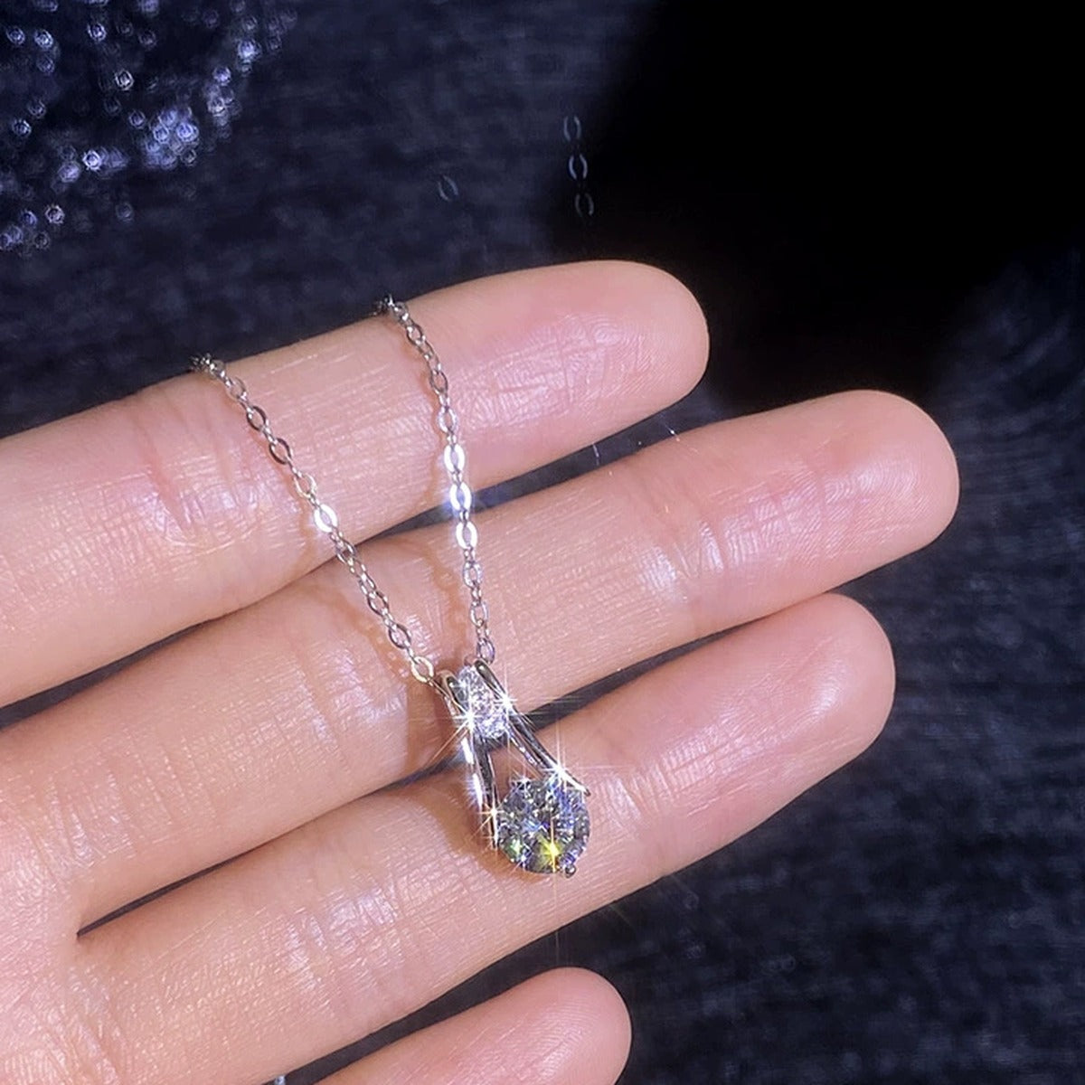 Teardrop Moissanite Pendant Necklace with Cubic Zirconia in Platinum-Plated S925 Sterling Silver worn on neckline by model