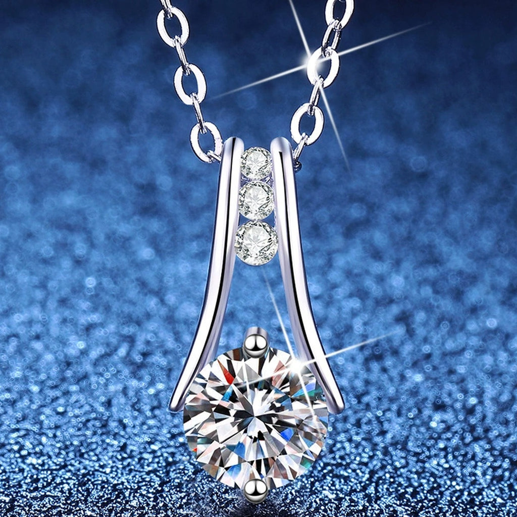 Teardrop Moissanite Pendant Necklace with Cubic Zirconia in Platinum-Plated S925 Sterling Silver blue background angled view