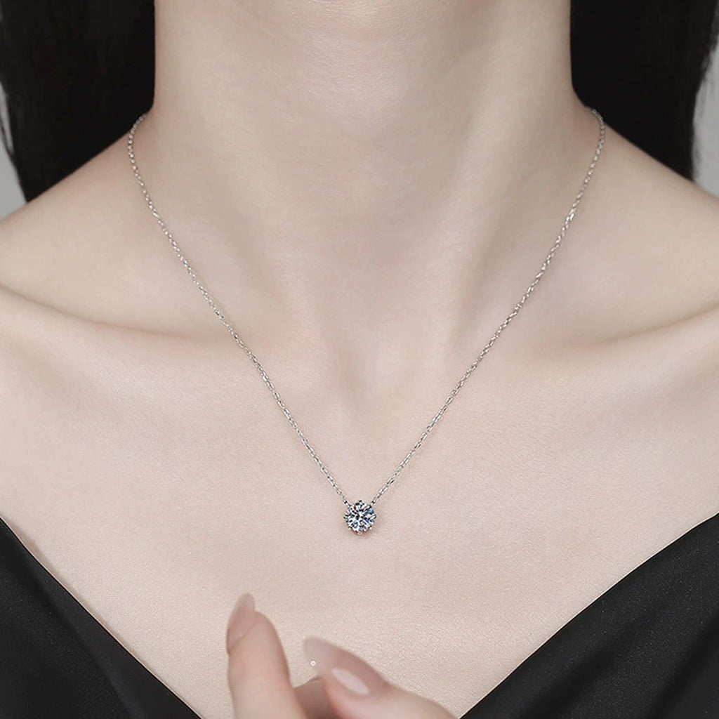 Six-Prong Moissanite Pendant Necklace in Platinum-Plated S925 Sterling Silver worn on neckline by model