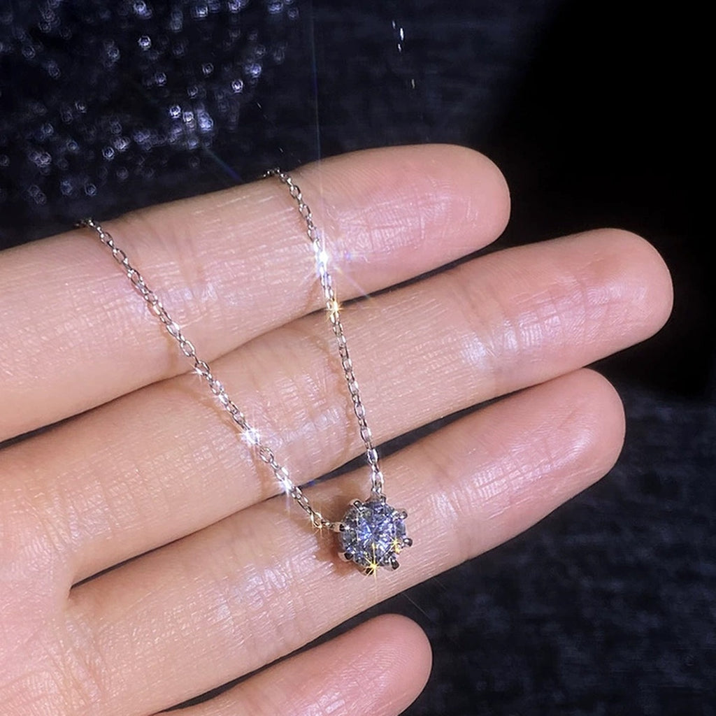 Six-Prong Moissanite Pendant Necklace in Platinum-Plated S925 Sterling Silver worn on neckline by model