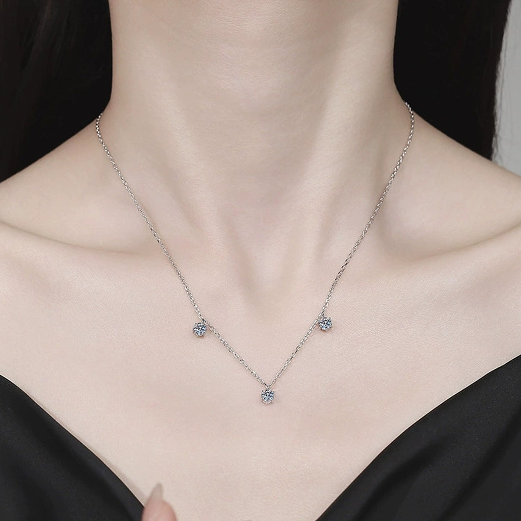 Station Moissanite Necklace in Platinum-Plated S925 Sterling Silver worn on neckline by model