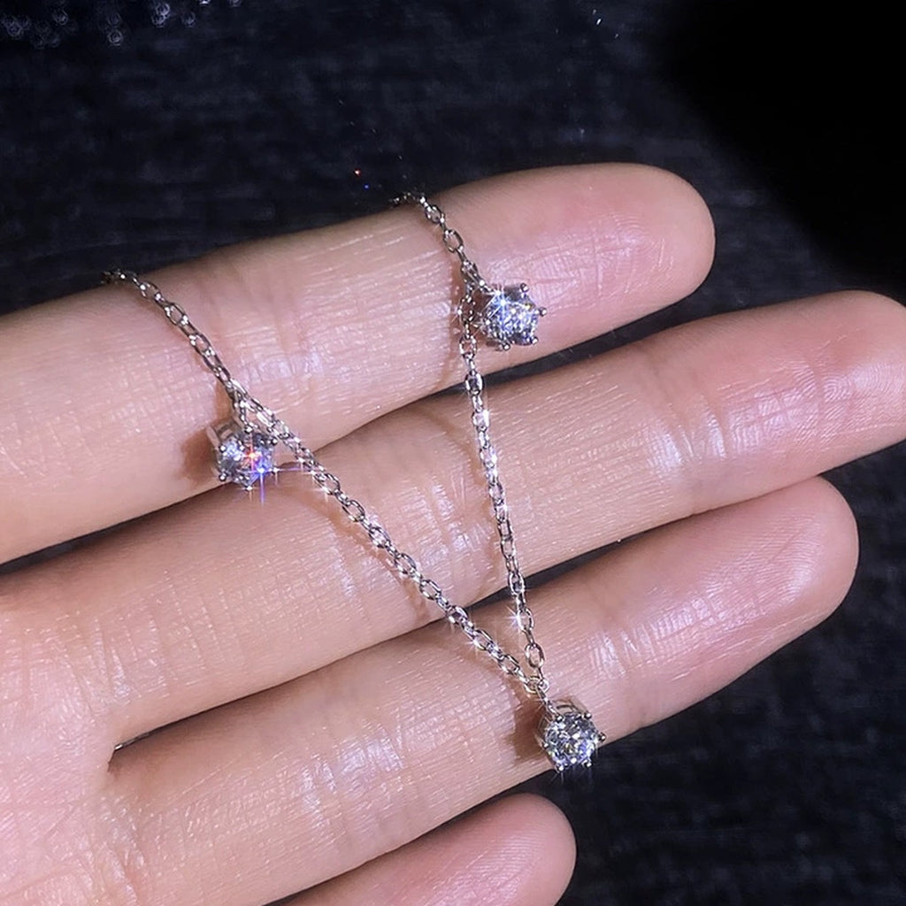 Station Moissanite Necklace in Platinum-Plated S925 Sterling Silver worn on neckline by model