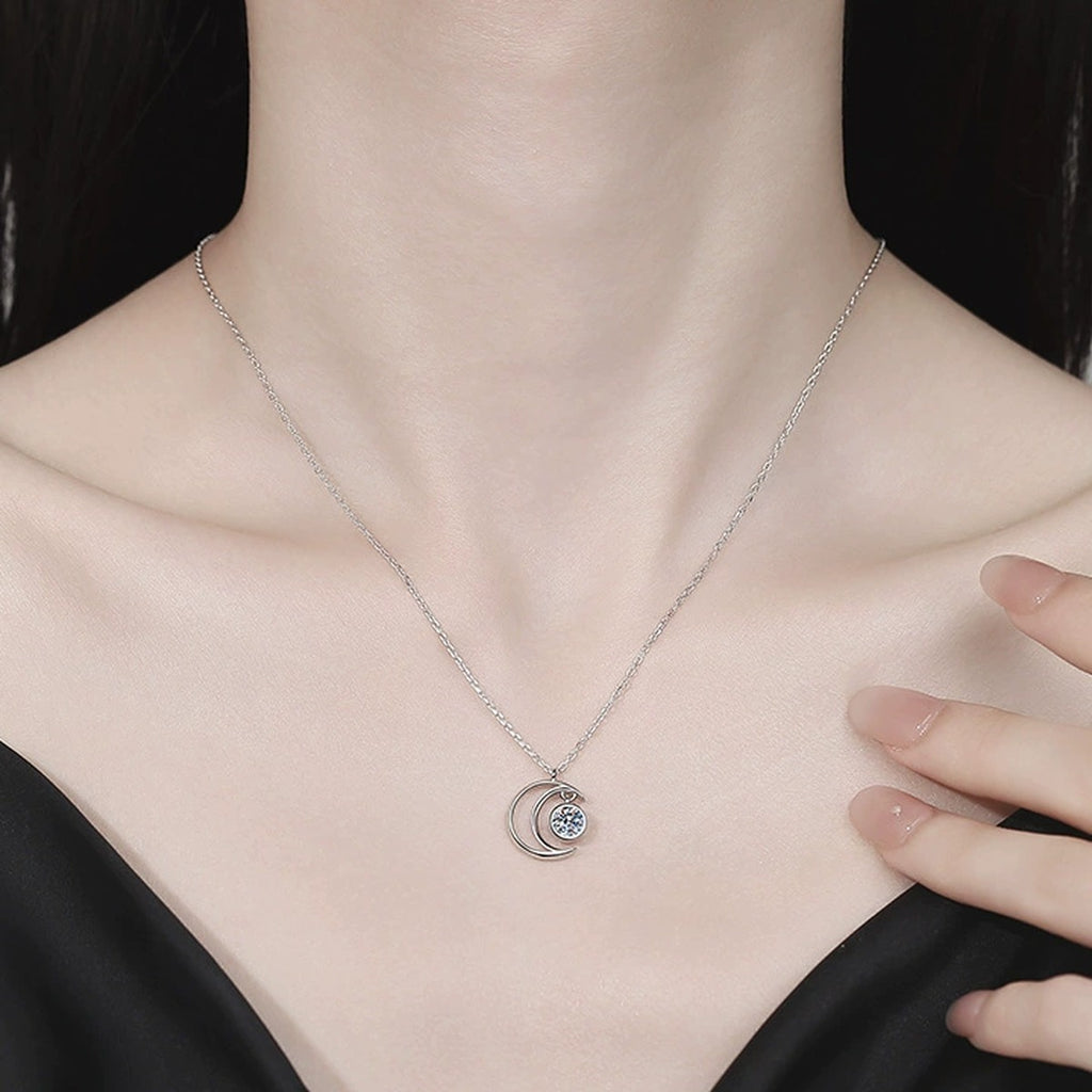 Crescent Moon Moissanite Pendant Necklace in Platinum-Plated S925 Sterling Silver worn on neckline by model