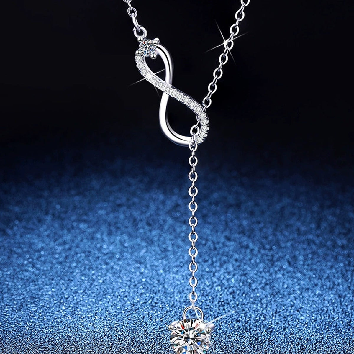 Drop Moissanite Pendant Necklace with Cubic Zirconia in Platinum-Plated S925 Sterling Silver blue background angled view