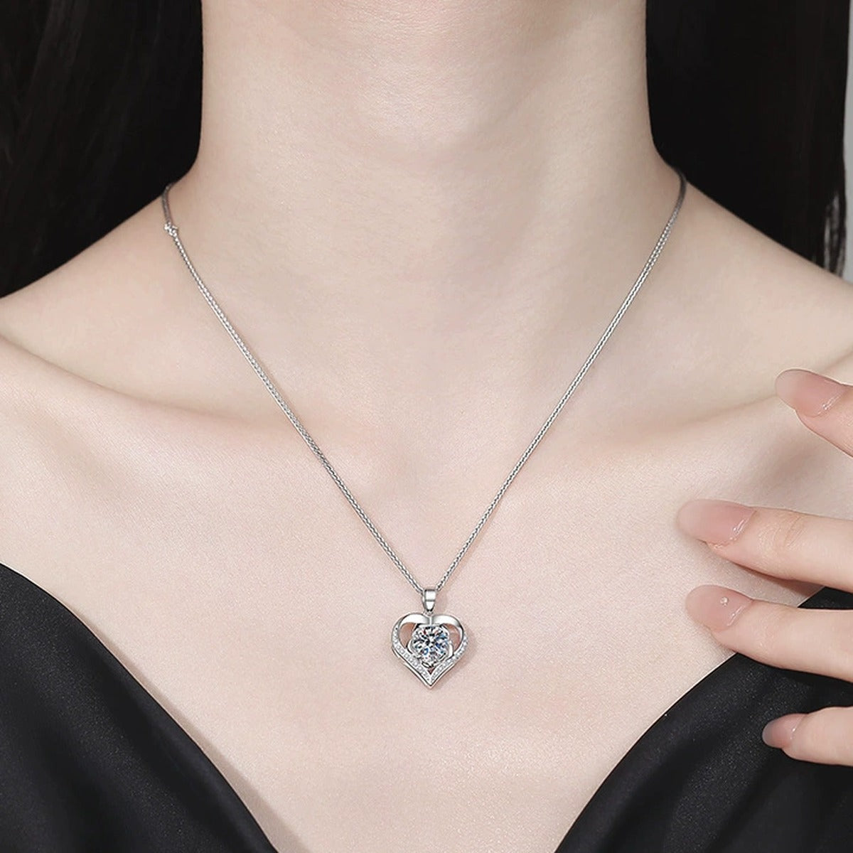 Heart Halo Moissanite Pendant Necklace with Cubic Zirconia in Platinum-Plated S925 Sterling Silver worn on neckline by model