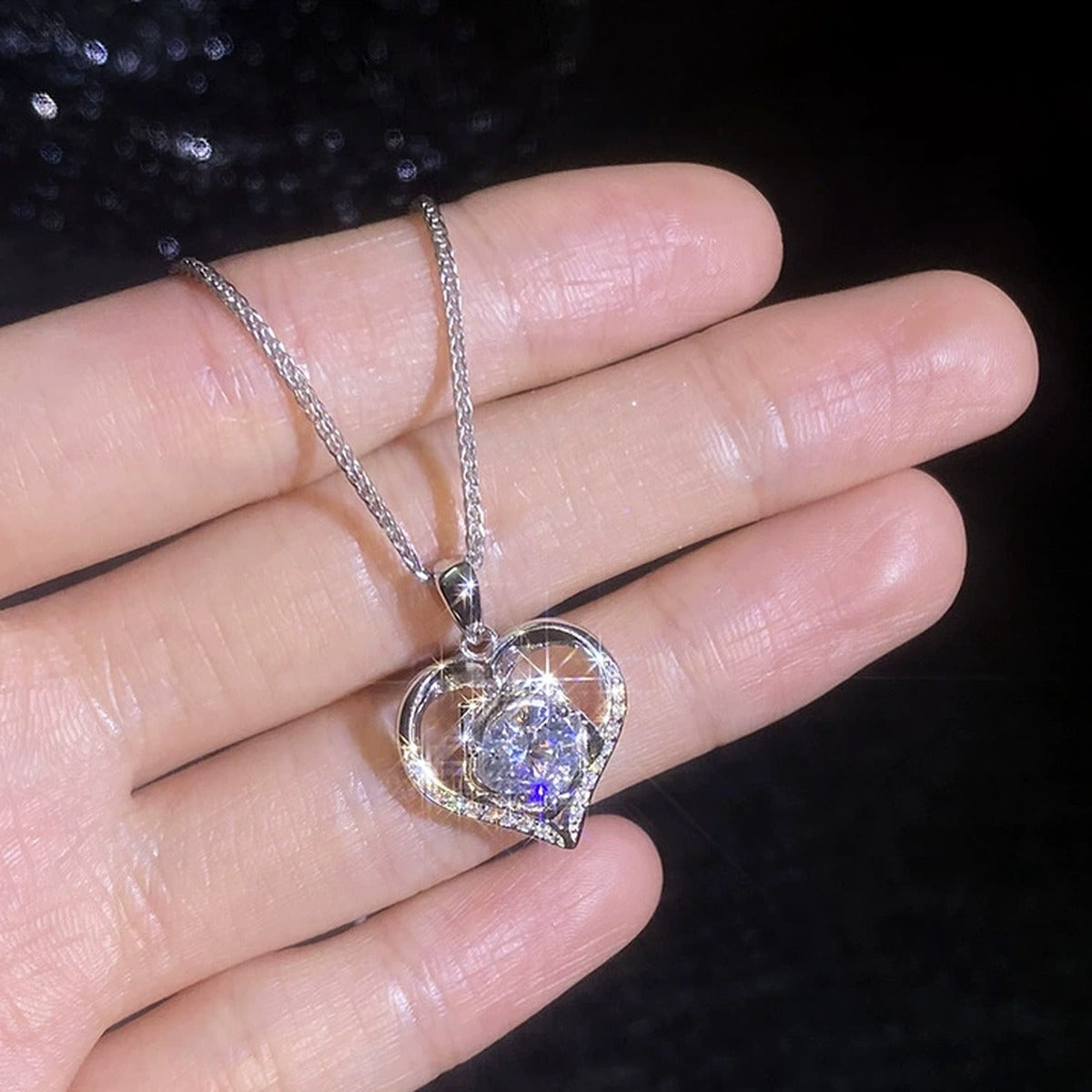 Heart Halo Moissanite Pendant Necklace with Cubic Zirconia in Platinum-Plated S925 Sterling Silver worn on neckline by model