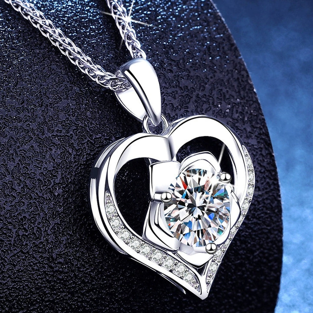 Heart Halo Moissanite Pendant Necklace with Cubic Zirconia in Platinum-Plated S925 Sterling Silver blue background angled view